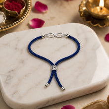 Load image into Gallery viewer, 925 Sterling Silver Infinity Rakhi for Brother | Premium Blue Thread Rakhi | Elegant Infinity Charm Raksha Bandhan Gift